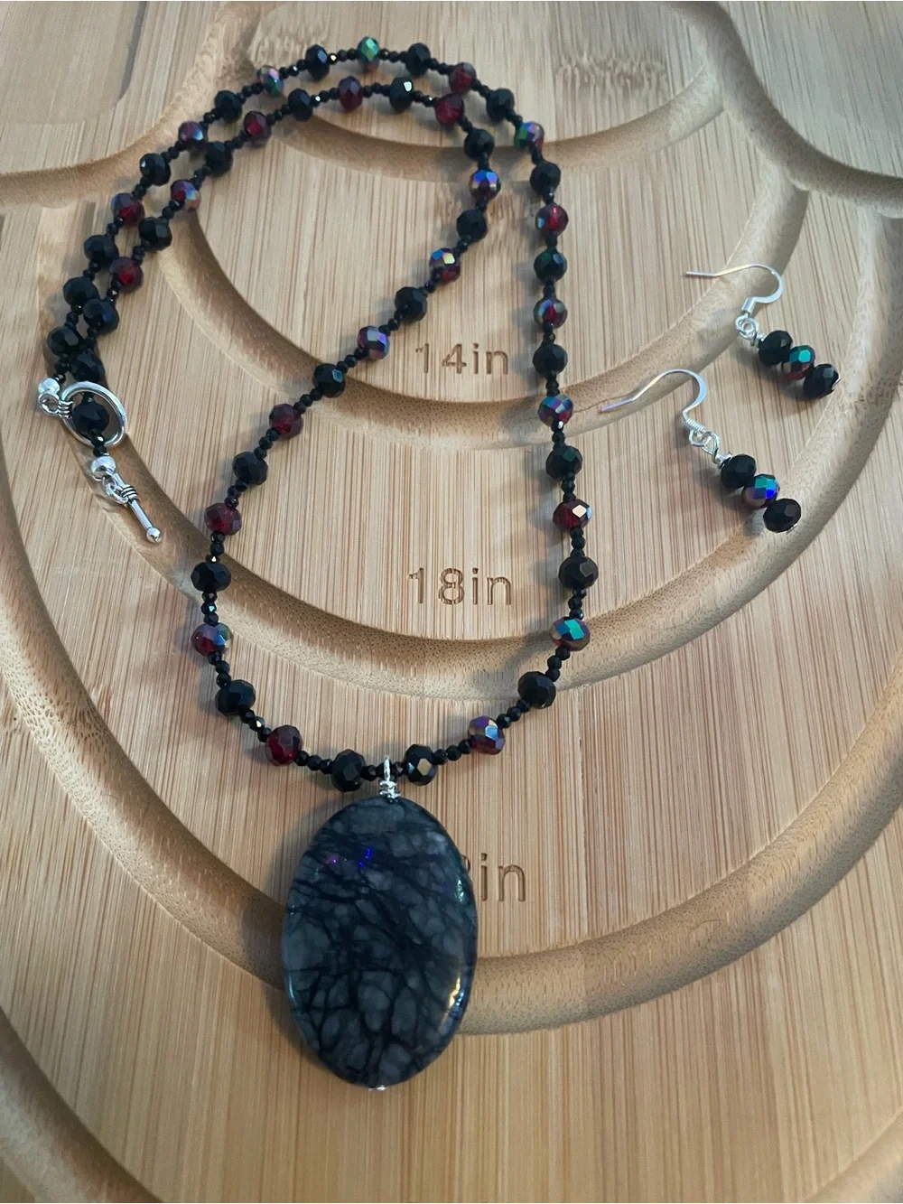 Handcrafted Black and Garnet Beaded Necklace with Oval Stone Pendant